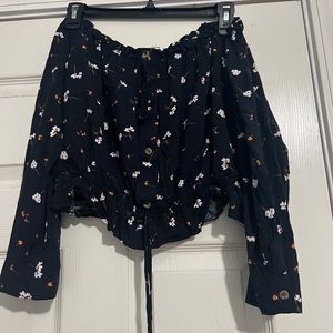 Black off the the shoulder shirt with flowers- size medium
